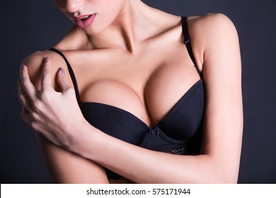 close up of sexy female breast in black lace bra