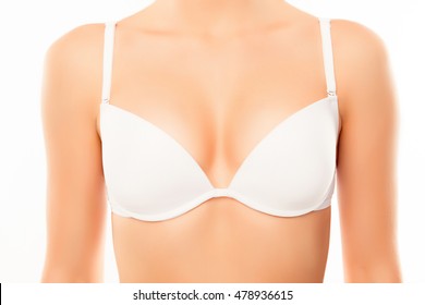 Close up of sexy woman with perfect chest in white bra