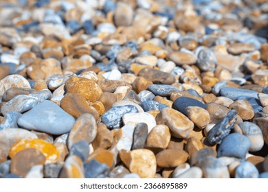a close up shallow depth of field photo of some pebbles and stones on Brighton beach on a British coastal town seaside  - Shutterstock ID 2366895889