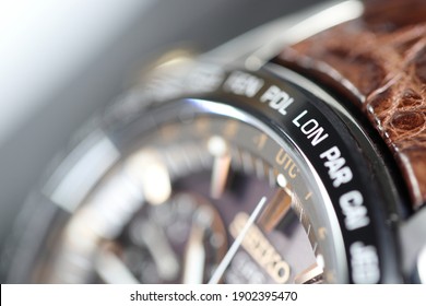 Close Up Shallow Focus Time Zone Cities Code On Luxury World Time  Watch Bezel 