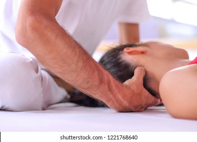 Close Up Of Shiatsu Therapy For Head And Neck Tension.