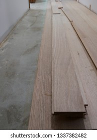 Close Up Of Shinning Gum (eucalyptus Nitens) Hardwood Floor Boards Stacked On A Concrete Hallway Floor Waiting To Be Laid On A House Renovation In Australia