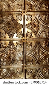 Close Up Of Shiny Ornate Tin Ceiling Tile With Copper Hue