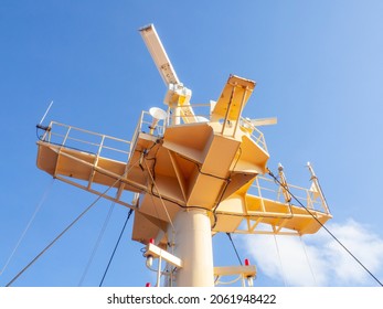 Close Up Of Ship's Communication And Floodlight System On Mast. Marine Navigation Concept, Yellow Metal Mast