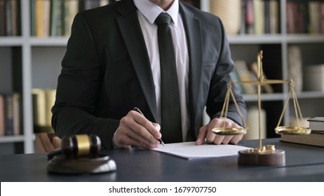 Close Up Shoot Of Lawyer Hand Checking Document In Court Room