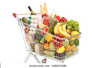 Close up of a shopping cart with food isolated on white background
