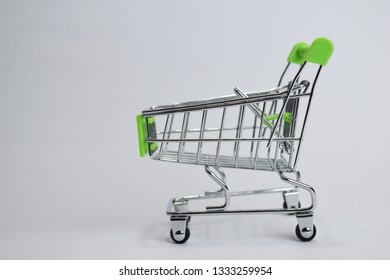 Close up shopping cart, shopping trolley isolated on white background - Powered by Shutterstock