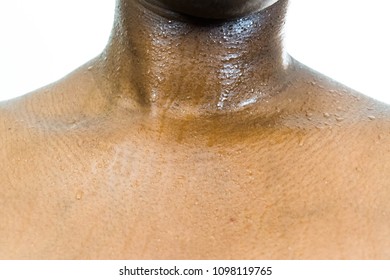 Close Up Shot Of An African Black Woman's Sweaty Neck And Chest For Summer Heat And Exercise Workout Concept 