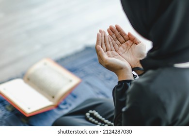 Close up shot of Asian beautiful Muslim woman in a hijab do a day pray that show her believe in god. - Powered by Shutterstock