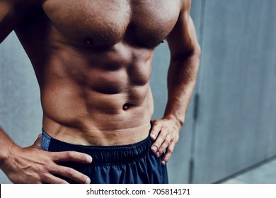 Close Shot Of Athletic Well Built Man With Six Pack Abs