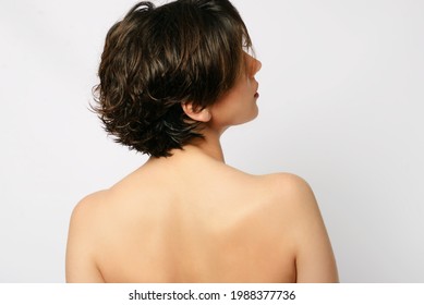 Close Up Shot Back Of A Woman With Short Hair, Beautiful Nose And Lips. Looking Right Side But We Can’t See The Eyes.