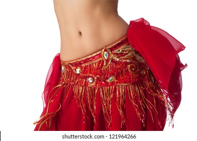 Close up shot of a belly dancer wearing a red costume shaking her hips. Isolated on white. Clipping path included.