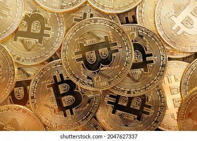 Close up shot of Bitcoin coins on black background,  A pile of Bitcoin Cryptocurrency Gold Bitcoin BTC Bit Coin.  Digital blockchain technology, bitcoin mining concept