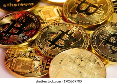 Close up shot of Bitcoins coins isolated on motherboard background. Crypto currency, bitcoin. BTC, Bit Coin. Blockchain technology, bitcoin mining.