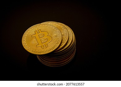 Close up shot of Bitcoins coins on black background. Crypto currency, bitcoin, BTC, Blockchain technology, bitcoin mining.