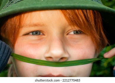 Close Shot Of A Boy Of Eight Years Old With Red Hair, Childhood Concept