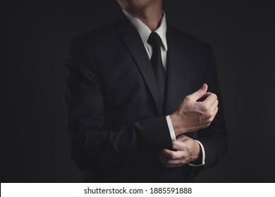 Close up shot of businessman in black suit. Elegant handsome on black background. - Powered by Shutterstock