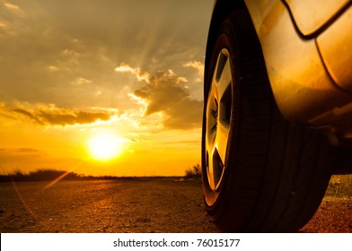 Close up shot of a car against sunset in the background