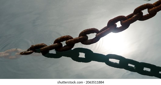 Close shot of a chain in the sea