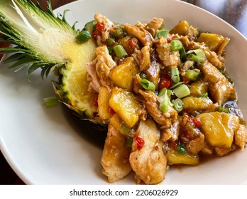 Close Up Shot Of Chicken Pineapple Bowl With A Fresh Cut Pineapple Bowl