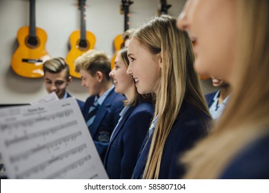 Close Up Shot Of Choir Students Singing In Their Music Lesson At School. 