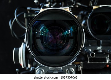 Close up shot of cinema lens with lot of equipment for filming cinema or movie in a division filming. Cinema lens. Photo lens.