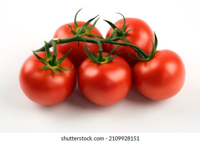 Close Up Shot Of Cluster Tomatoes On A White Background