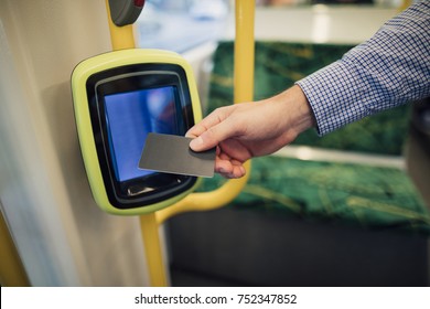 Close up shot of a commuting businessman scanning his travel card on a tram in Melbourne, Victoria. - Shutterstock ID 752347852