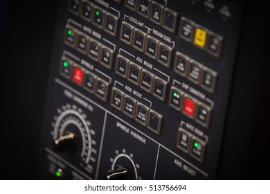 Close up shot of a control panel with many buttons.