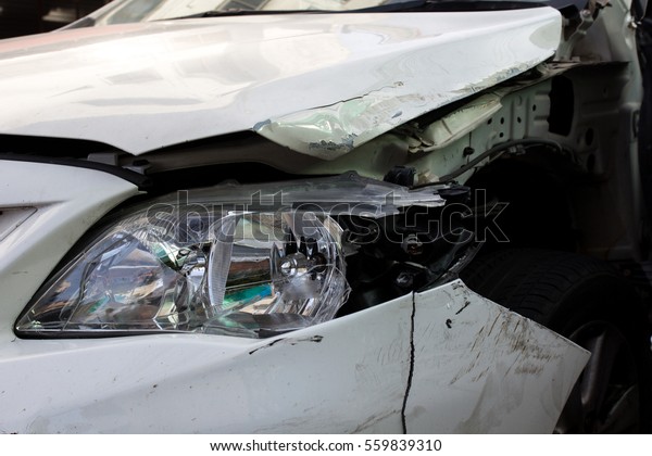 Close up shot of crashed car\
from accident. insurance claim car crash concept. drink and\
drive.