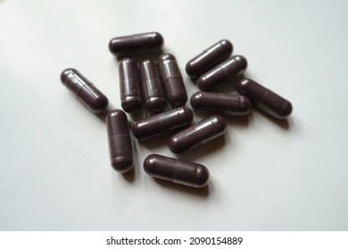 Close Shot Of Dark Purple Capsules Of Bilberry Extract Dietary Supplement