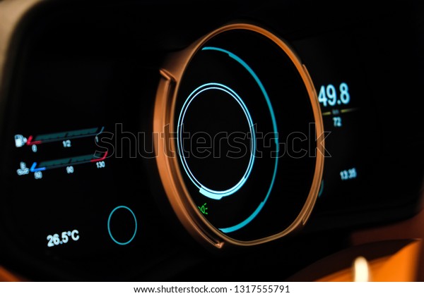 Close up shot of a dashboard in a car. Car\
dashboard. Brown leather dashboard details with indication\
lamps.Car instrument panel. Dashboard with speedometer, tachometer,\
odometer. Car detailing.