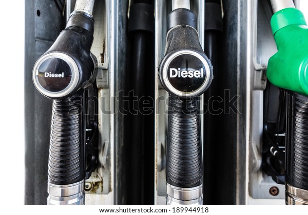 close\
up shot of a diesel gas pump in a service\
station
