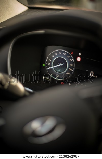 Close up shot of a digital dashboard of a\
new car, showing the speedometer.\
