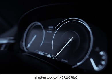 Close up shot with the digital speedometer of a car.