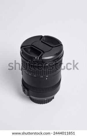 Close up shot of DSLR camera lens 18-200mm isolated on white background