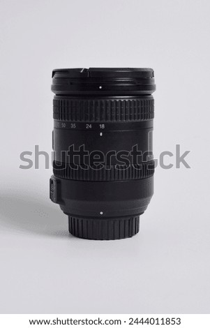 Close up shot of DSLR camera lens 18-200mm isolated on white background