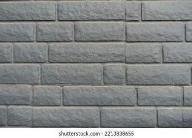 Close Shot Of Dusty Black Painted Brick Veneer Wall