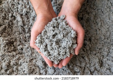 Close Shot Of Eco Friendly Cellulose Insulation Filling Held In Hand 