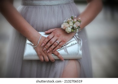 A close up shot of an elegantly dressed bridesmaid