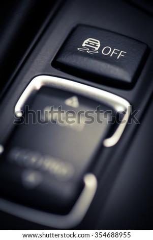 Close up shot of the ESP button in a car.