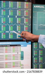 Close Up Shot Of Forex Stock Market Trader Woman Pointing At Screen Showing Real Time Trading Data. Financial Analyst Signaling On Display Change Of Profit While In Office Workspace.