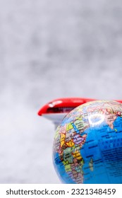 Close up shot of globe with defocused background in portrait orientation.