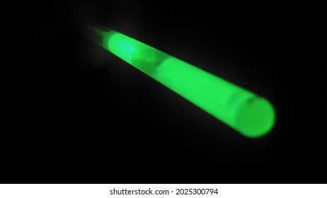 Close up shot of green glowstick at night