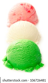 Close Up Shot Of Green, White, And Red Ice Cream Ball On White Background - Italian Ice Cream Concept