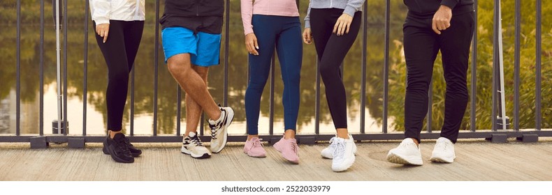 Close up shot of a group of friends legs engaged in a fitness training session outdoors. This team of people enjoys working out together, engaging in sports activities to stay fit and active. - Powered by Shutterstock