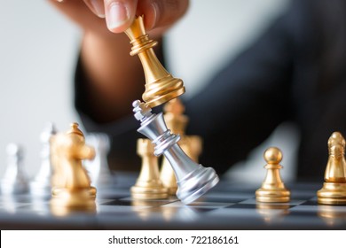 Close Up Shot Hand Of Business Woman Moving Golden Chess To Defeat And Kill Silver King Chess On White And Black Chess Board For Business Challenge Competition Winner And Loser Concept