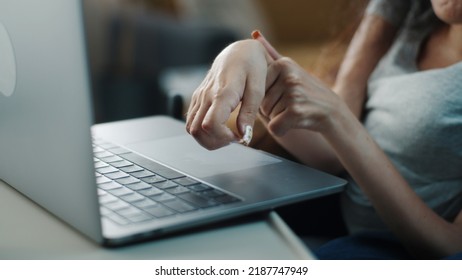 Close shot of the hands of a woman with spinal muscular atrophy surfing the Internet or social media typing on a laptop keyboard - Shutterstock ID 2187747949