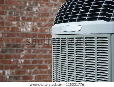 Close up shot of  High efficiency modern AC-heater unit on brick wall background