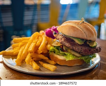 Close Up Shot Of A Impossible Burger And French Fries At Arizona